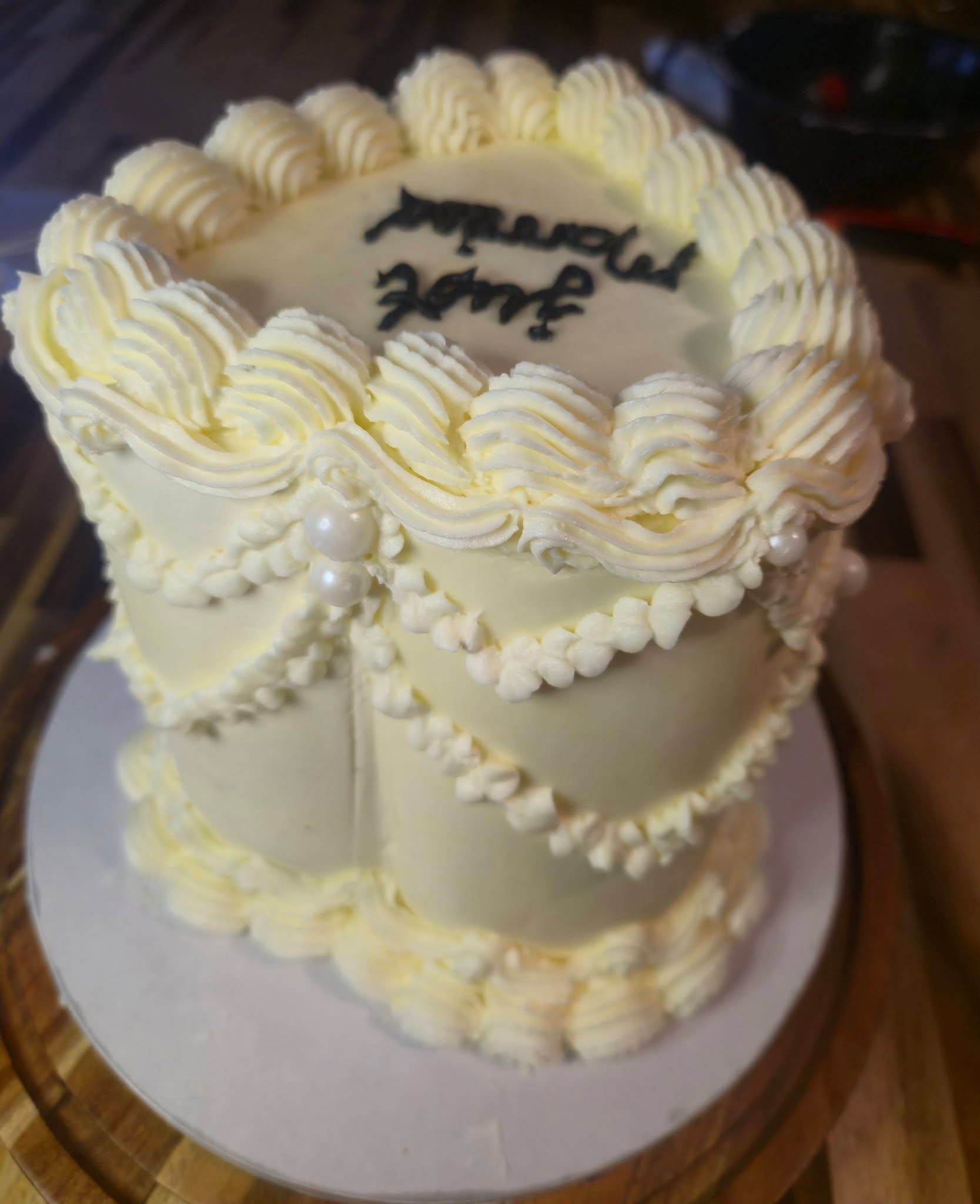 Heart-shaped decorated celebration cake